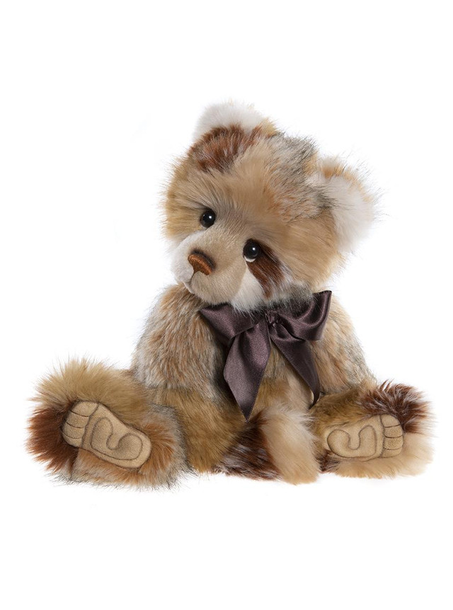 Meet Scott, a sweet and comforting companion for all ages. He is made from super-soft plush in shades of cream and brown. He has a-paw-able 'Who me?